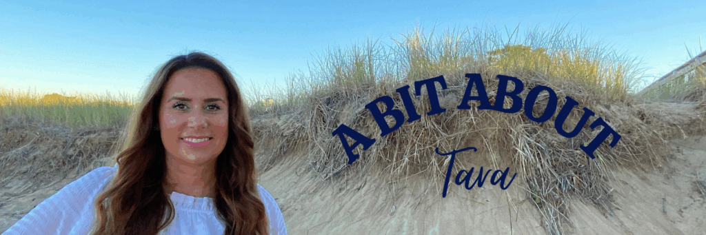 Tara standing on a sand dune, smiling and looking confident, representing her life mental performance coaching work